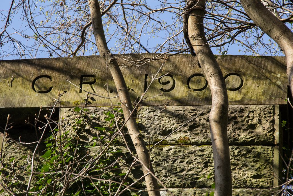Capstone engraved with "C.R. 1900" on Bridge Abutment at Longwood Drive